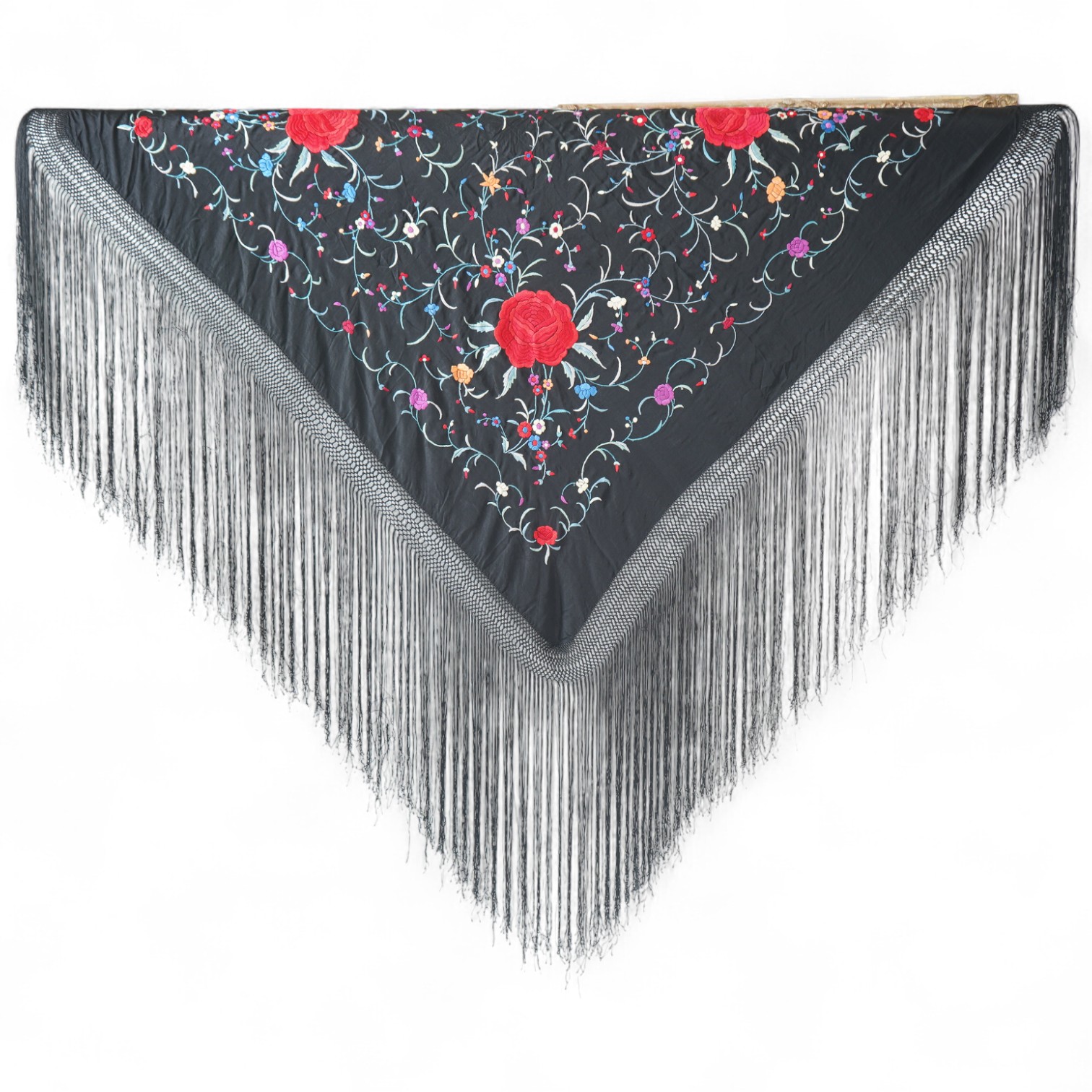 A late 19th century Chinese black silk polychrome floral embroidered shawl with long silk fringing. Embroidered with large red roses and an all over multi coloured floral sprig design. 123cm x 108cm. Condition, silk and
